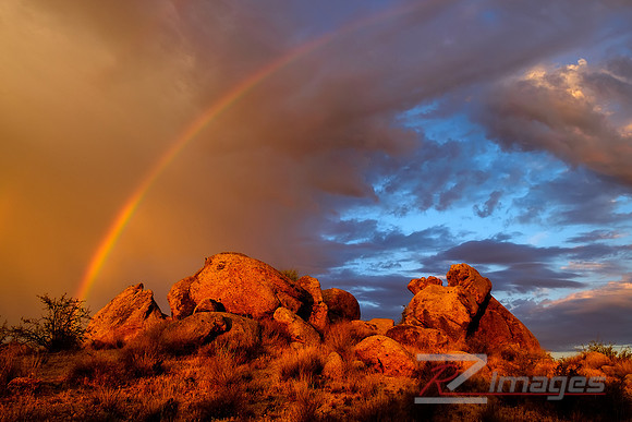 Rainbow in the desert sky at Sunrise.