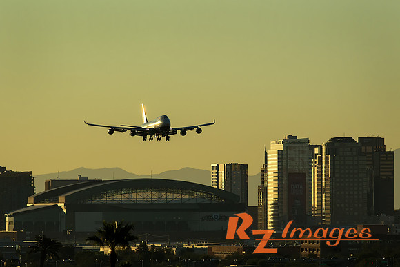 747 descending into Sky Harbor Airport at Sunset.